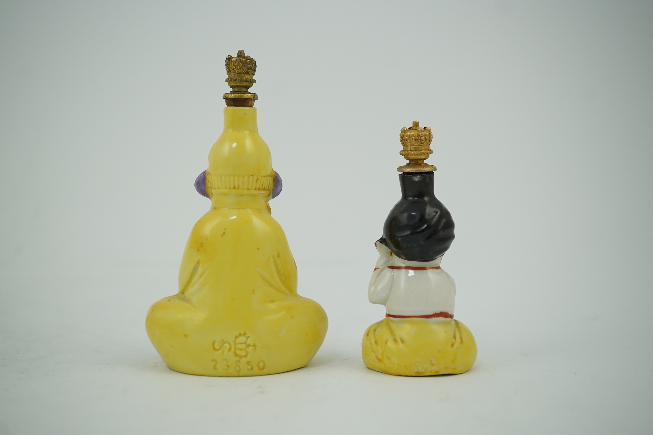 Two Continental porcelain figural scent bottles with gilt stoppers, largest 9cm high. Condition - good